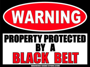 BLACK_BELT___PROPERTY_PROTECTED_BY_WARNING_SIGN