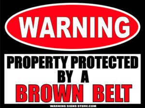 BROWN_BELT___PROPERTY_PROTECTED_BY_WARNING_SIGN